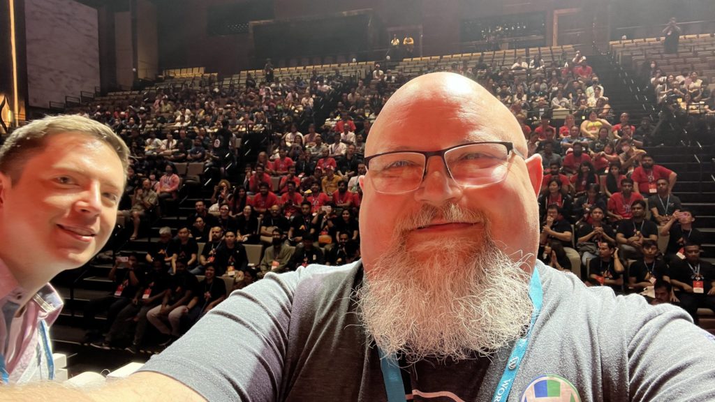 Topher Derosia taking a selfie with crowd at his talk at WC Asia